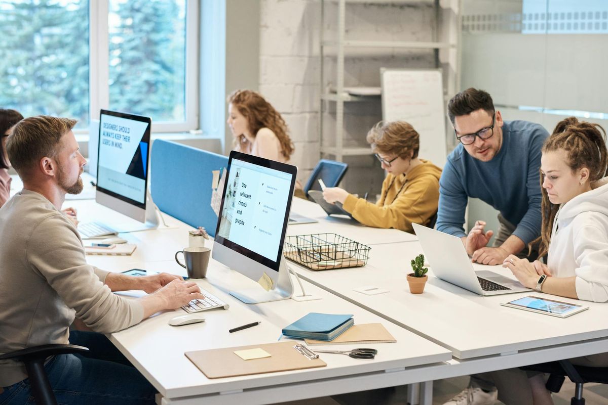 Senior delivery team working directly together around product, planning, and execution artifacts